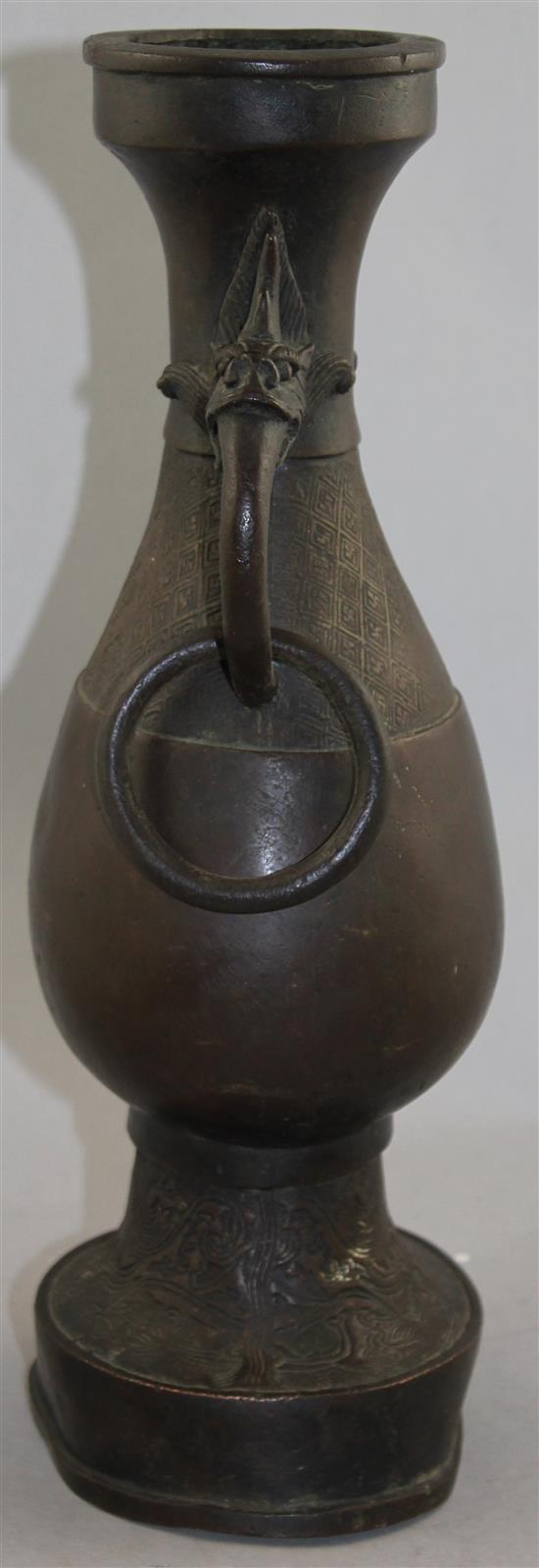 A large Chinese bronze hu vase, Yuan Dynasty, 38.5cm, foot mis-shapen